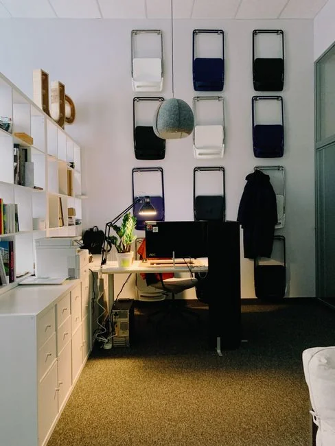Top view of a minimalist setup featuring a tablet and smartphones on a white surface.